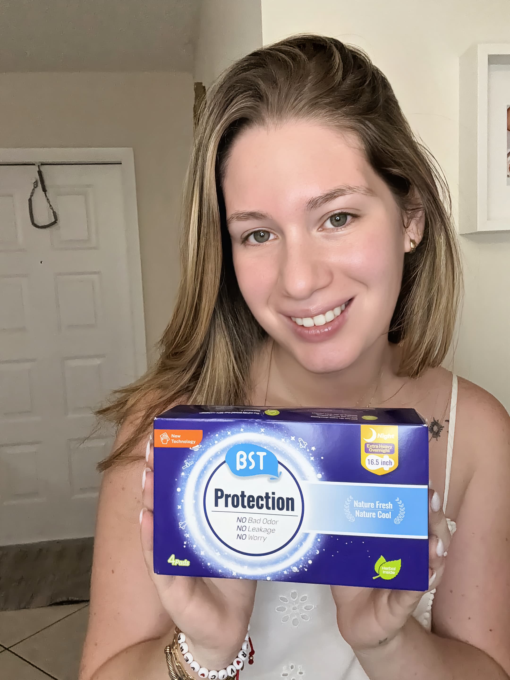 Influencer holding BST Protection breathable sanitary pads
