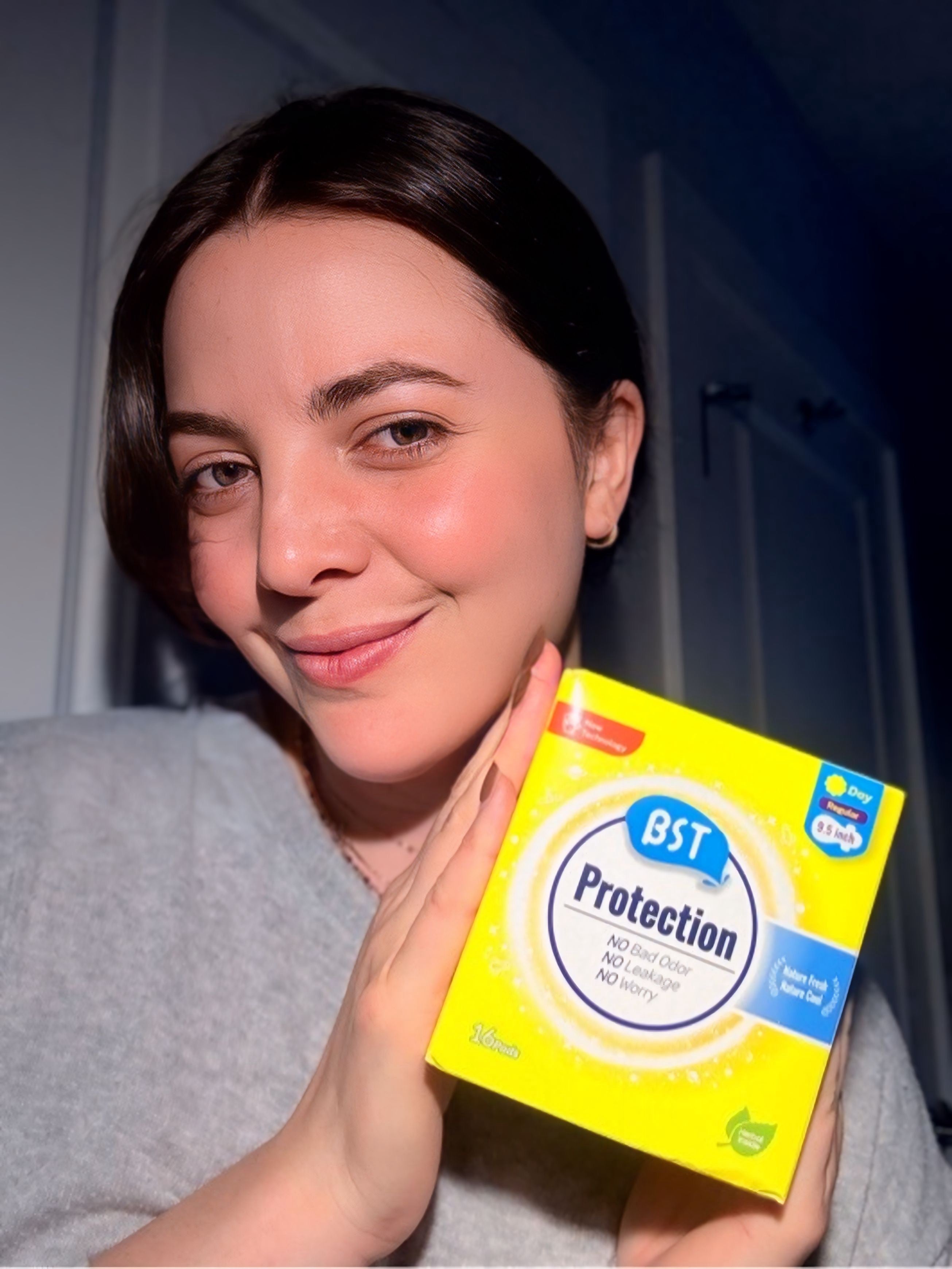 Influencer showing BST Protection sanitary pads for sensitive skin